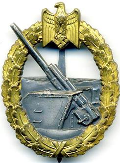 Аверс и реверс знака морской артиллерии.