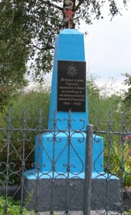 д. Нежков Белыничского р-на. Братская могила на кладбище, в которой похоронено 54 партизана, в т.ч. 4 неизвестных, погибших в 1942-1944 годах.