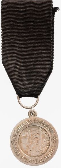 Аверс и реверс медаль Скорби ордена Креста Свободы. 