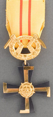 Крест 3-го класса ордена Креста Свободы за военные заслуги в мирное время.