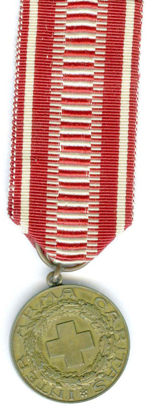 Аверс и реверс бронзовой медали «За заслуги» Финского Красного Креста.