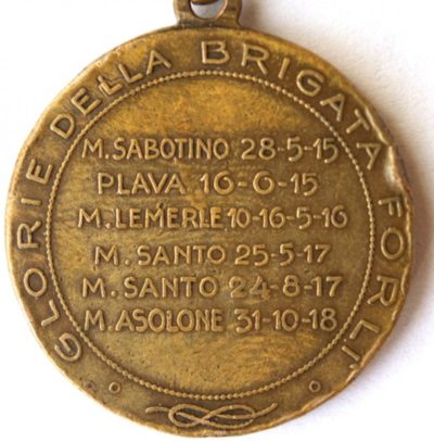 Аверс и реверс памятной медали пехотной бригады «Forli». Медаль изготовлена из бронзы, диаметр - 26 мм.