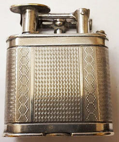 Зажигалка «Unique А» фирмы Dunhill, выпускалась в 1930-х годах.