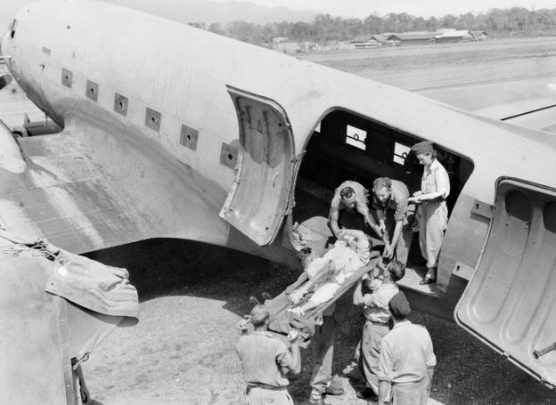 Погрузка раненных в санитарный самолет. 1944 г.