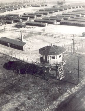 Сторожевая вышка, забор и бараки лагеря «Растон». 1944 г. 