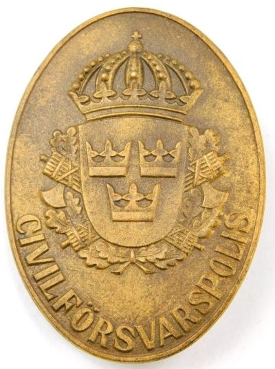 Значок гражданской обороны Швеции.